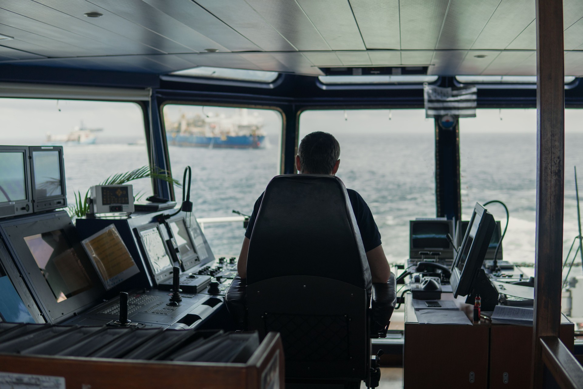 Deck navigation officer on the navigation bridge. He looks to sea