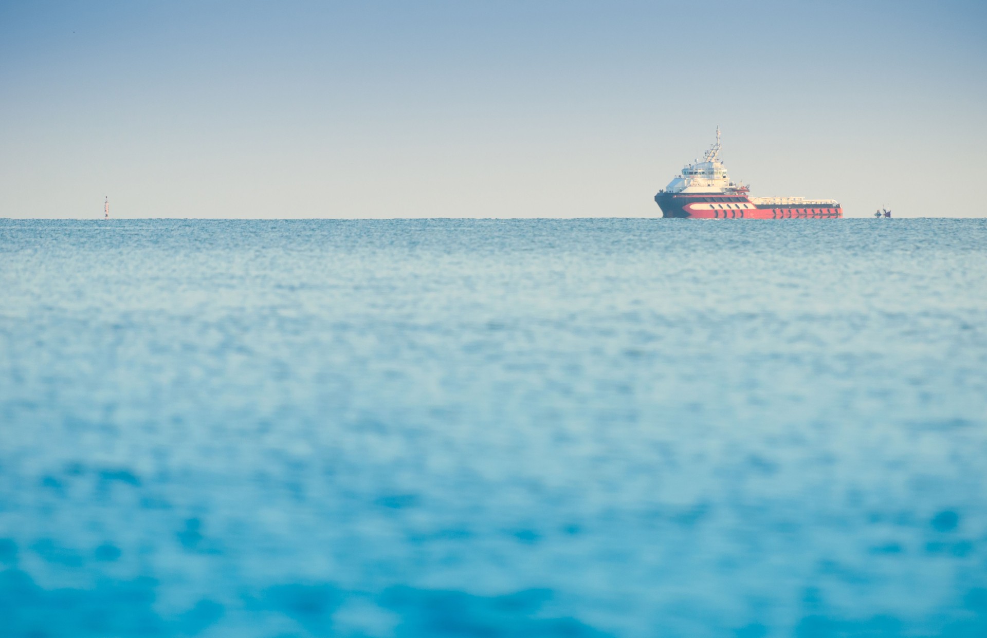 Large container ship in deep blue ocean
